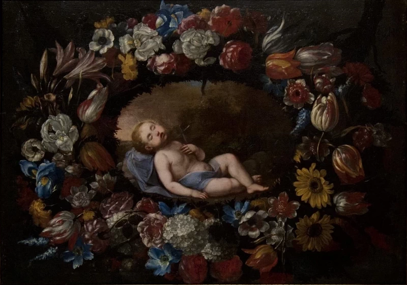 Il Bambino Gesù dormiente in una ghirlanda di fiori
